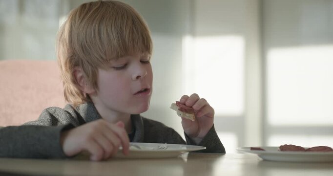 Kid Boy Eat Rice and Sausage. Eating Breakfast Lunch in Kitchen. 4K 10-bit