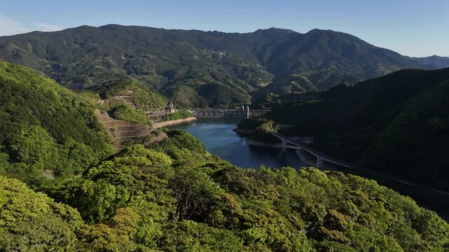 Narufuchi Dam, foresty mountains in fore and background, Japan