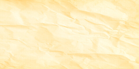 Fototapeta premium Crumpled yellow paper texture background with creased folds Perfect as an abstract, minimalist background or texture.