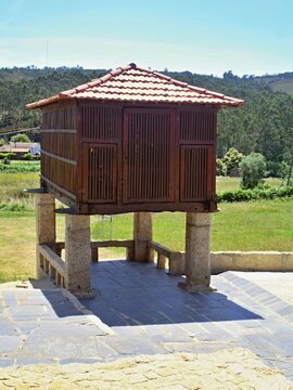 Traditional Portuguese espigueiro granary building in a rural landscape. Quintadona, Norte, Portugal