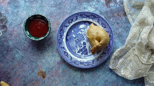 Delicious moments of enjoying indian street food singara at home