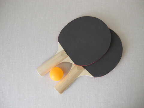 Two table tennis rackets for beginners and a tennis ball