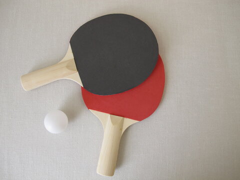 Two table tennis rackets for beginners and a tennis ball