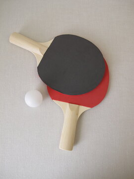 Two table tennis rackets for beginners and a tennis ball
