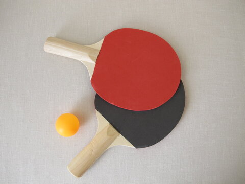 Two table tennis rackets for beginners and a tennis ball