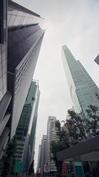 Singapore business district featuring modern glass skyscrapers with financial offices corporate headquarters and impressive urban architecture in the heart of Asia