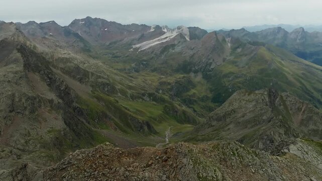 Aerial view of Timmelsjoch Pass in the Tyrol Alps on the border of Austria and Italy featuring rugged mountain peaks breathtaking natural landscapes and European travel tourism