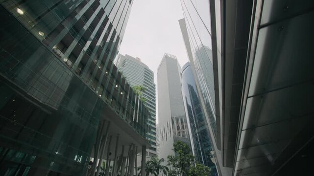 Singapore City business district featuring a high rise building with vertical garden architecture sustainable urban design and modern financial offices in Asia