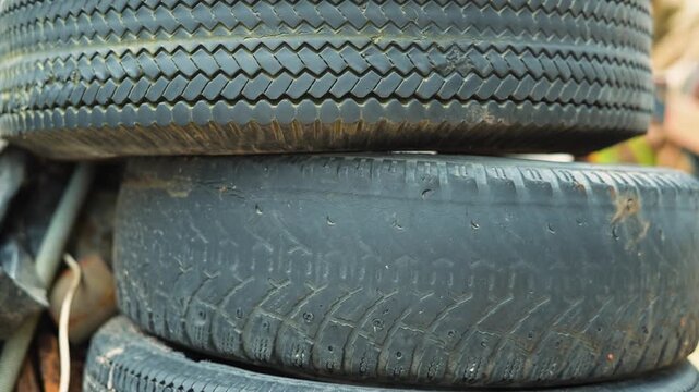 A collection of used tires . different treads and conditions of the tires, highlighting their practical use