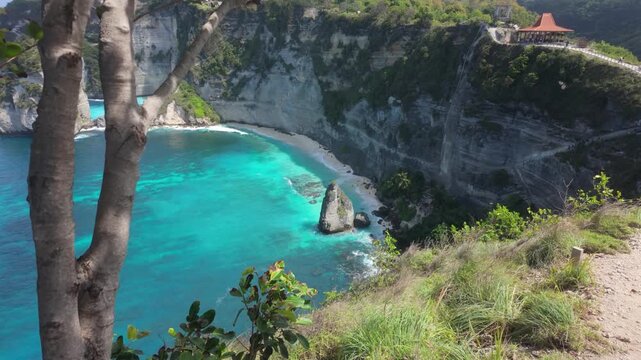 Diamond Beach in Nusa Penida, Bali. (Pantai Diamond ) A slow motion push in shot of the white shores, dramatic cliffs and crystal-clear turquoise waters. It looks like paradise.
