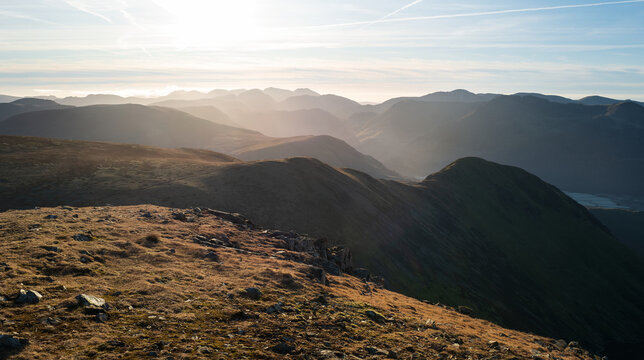Views from Grasmoor towards Whiteless Pike, Robinson, Haystacks, High Crag and High Stile early on a winters morning in Cumbria, Lake District, England UK.