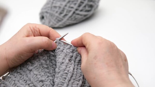 female hands knitting close up