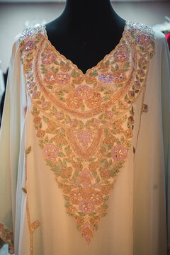 Close up of embroidered luxury traditional kaftan with floral beadwork