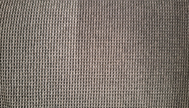 a close-up, full-frame shot of a heavy, tightly woven upholstery fabric texture