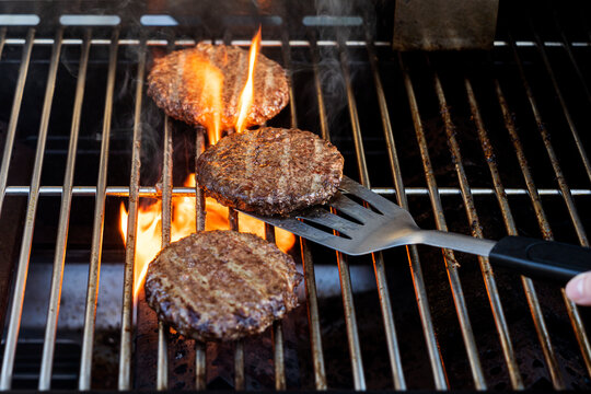 Burgers cooking on barbecue grill