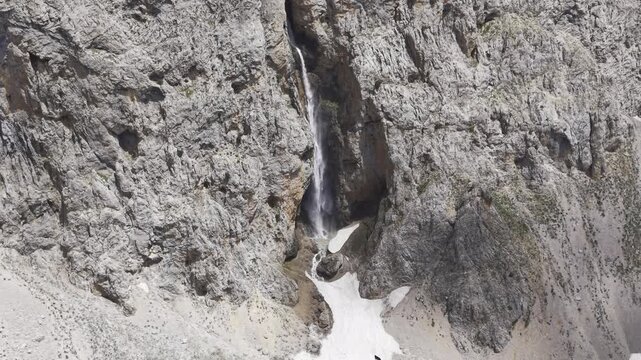Aerial Drone View of Kirkmerdiven Waterfall in Ovacik, Tunceli, Turkey Flowing Through Rugged Canyon Landscape