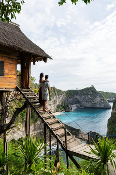 Couple admires the ocean view from a treehouse at Diamond Beach
