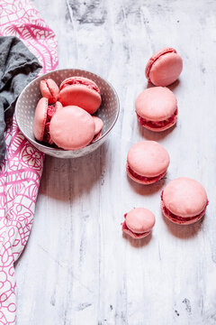 Pink macarons filled with raspberry buttercream