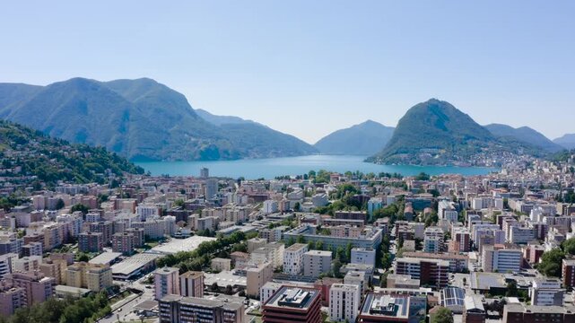  Lugano city aerial view with Lake Lugano and Monte San Salvatore mountain. Lugano, Canton of Ticino, Switzerland.