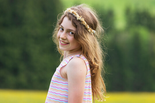 Smiling portrait in a flower meadow Mondsee Salzkammergut Austria