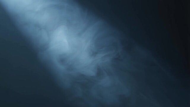 A cool illuminated mist effect with slow lateral drift and soft density changes