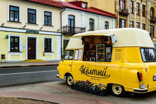 GRODNO, BELARUS - June 4, 2026: Semashko historic hotel in central Grodno main tourist pedestrian street with cafe and cars.
