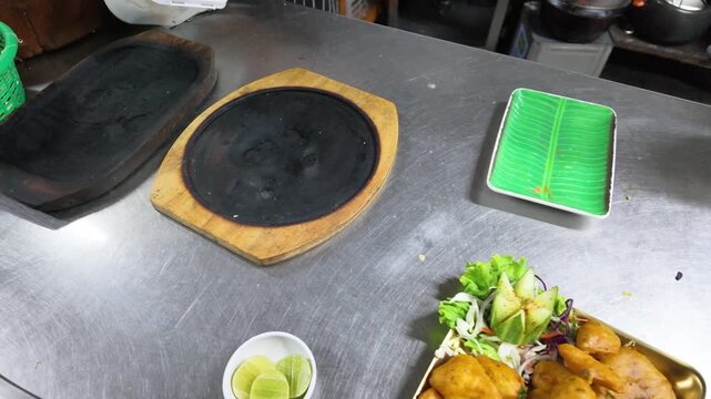 Overhead View of Empty Sizzler Plates in Commercial Kitchen