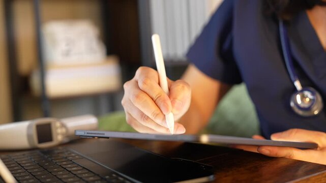 Nurse reviewing patient information on digital tablet during a night shift, Electronic medical records, Healthcare documentation, Hospital technology,Patient care,Modern nursing,Digital healthcare wor