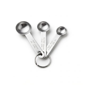 Stainless steel measuring spoons set on ring, professional metal kitchen measuring tools for baking, silver teaspoon and tablespoon set on white background