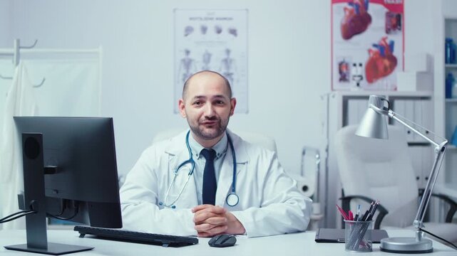 Young physician offers internet medical advice from a private clinic office, using telemedicine technology to consult patients and provide healthcare support.