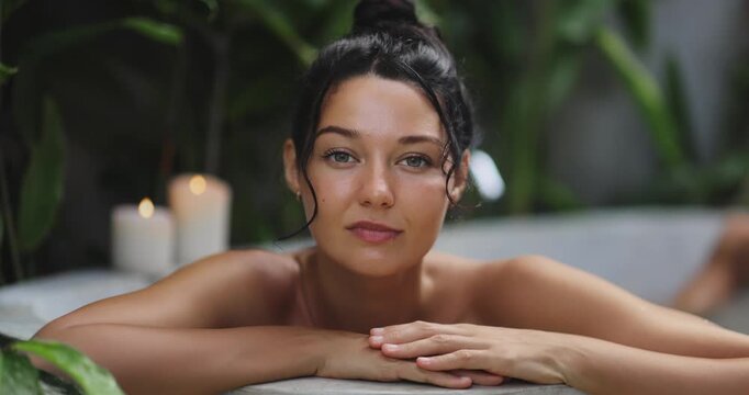 Close-Up Woman Relaxing in Spa Bath Slow Motion Clip