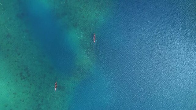 Aerial View of Traditional Rowboat on Crystal Clear Blue Ocean in Okinawa