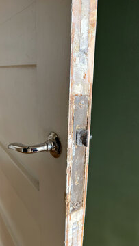 Old Door Edge with Peeling Paint During Restoration