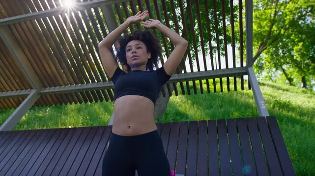 Woman Performing Knee Raise in Outdoor Park