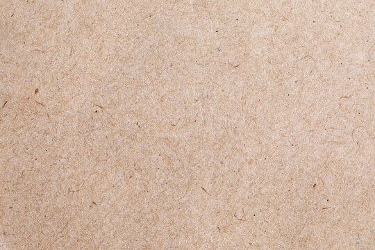 Brown craft paper texture background, recycled paper fiber sheet for design.