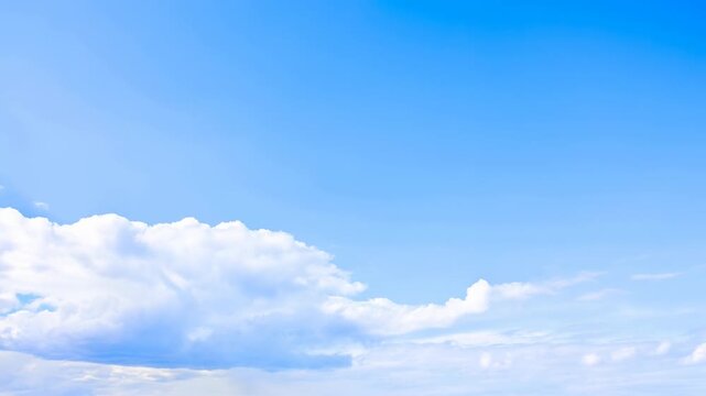 Vivid blue sky above low cumulus cloud bank with drifting wisps, bright daylight atmosphere, soft white layers, open airy space, calm summer weather, natural scenic background