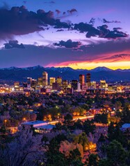 Fototapeta premium Denver cityscape at sunset with Rocky Mountains in the background.
