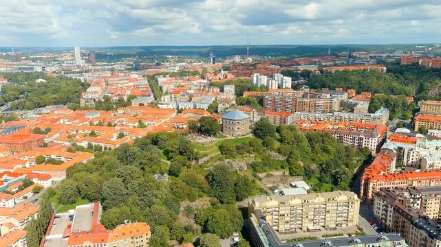 Gothenburg, Sweden. Skansen Kronan - A fortress on a hill with panoramic views of the city. Panorama of the city. Summer day. Cloudy weather. Drone footage, Point of interest