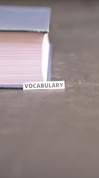 Vocabulary Concept on White Paper at Book Edge, Language Learning Vertical Video