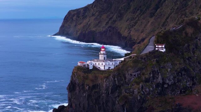 Ponta Do Arnel Lighthouse (Farol do Arnel) During Sunrise In Sao Miguel Island, Azores, Portugal - Aerial Drone Shot