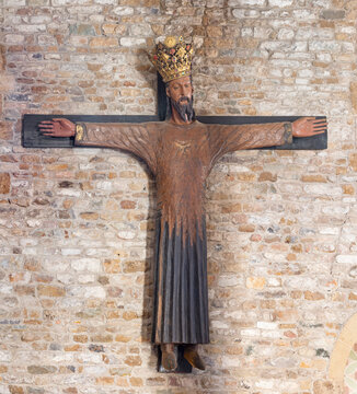 PISA, ITALY - JUNE 22, 2026: The medieval carved polychrome staue of Crucifixion - Jesus as the Kind in the church  Chiesa di San Sisto from year 1370.