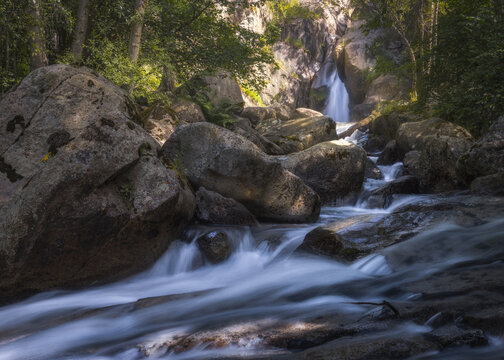 Moli Del Salt Waterfall Flows Through Smooth Rocks in Cerdanya, Catalonia