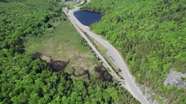 Aerial View Of Saco Pond Along Route 302 Within Crawford Notch State Park In New Hampshire, USA. - tilt up shot