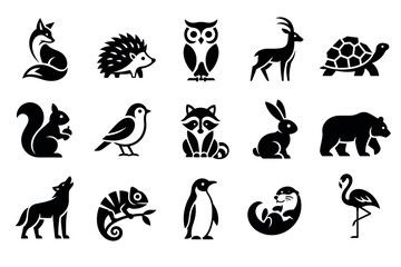 Fototapeta premium Black animal icons featuring fox hedgehog owl deer turtle squirrel bird raccoon rabbit bear wolf chameleon penguin otter and flamingo