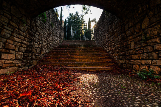Sunlight Through the Stone Passage at Brescia Castle, Italy