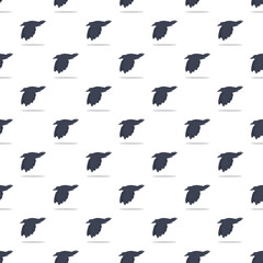 Fototapeta premium Flying crows creating a repeating bird pattern on a white background