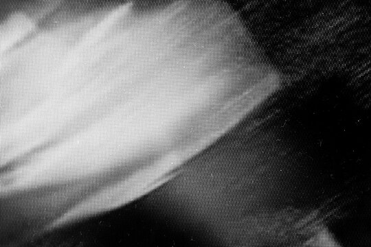 Grainy photocopy noise texture with dusty scanner effect and rough grayscale grain. Retro Y2K xerox grunge background with uneven density, soft gradients and chaotic dotted pattern.