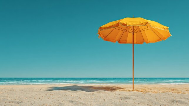 Colorful beach umbrella on golden hot sand with copy space for summer design, sunny tropical ocean landscape, clear blue sky, relaxing vacation background with coastal scenery and ample space for text