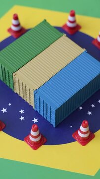 The cargo container ban on the brazil flag as a conceptual backdrop for the export and logistics of goods. The cargo container embargo on the brazil flag as a backdrop for your design