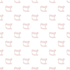 Fototapeta premium Vampire fangs creating a spooky seamless pattern, perfect for halloween designs